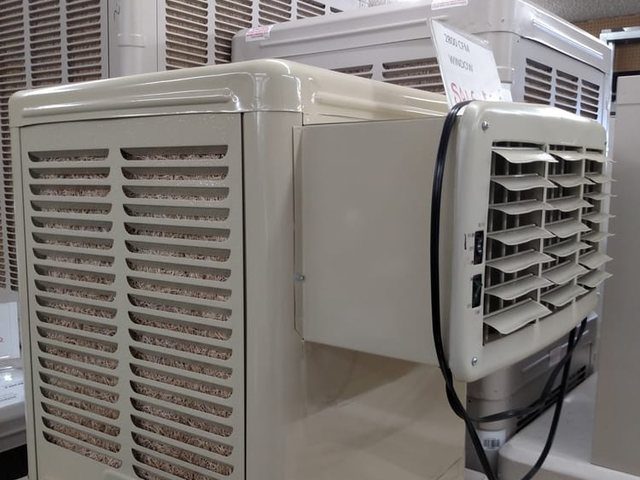 An evaporative cooler on the floor at the Mesa store