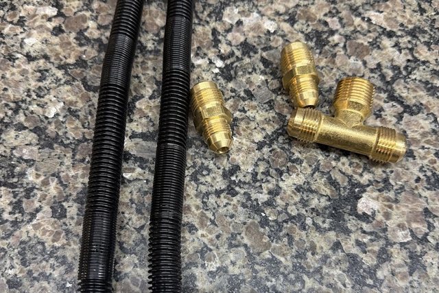 Gas connectors and brass fittings on the parts counter