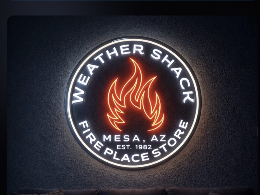 The Weather Shack logo sign lit up on the showroom wall